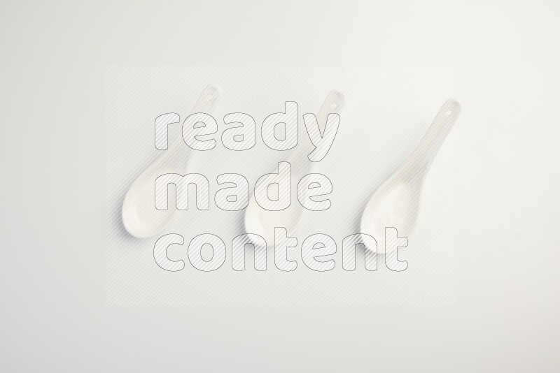 white ceramic soup spoon on white countertop