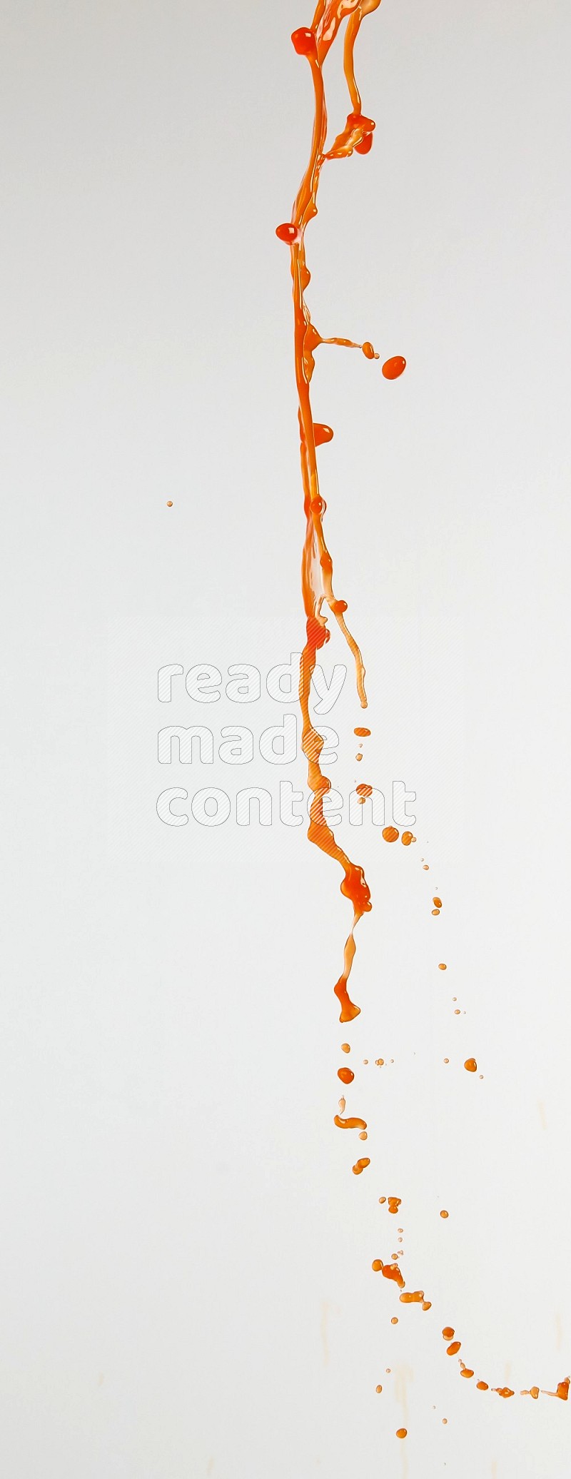 Orange liquid splash and drops on white background