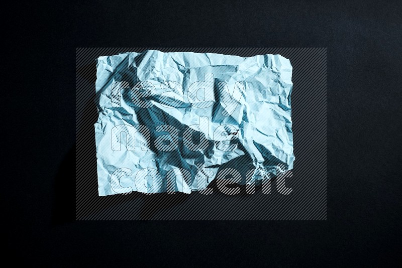 Blue paper sheet on black background