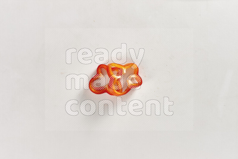 Red bell pepper slices on white background