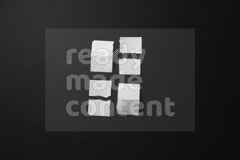 Ripped notebook sheet on black background