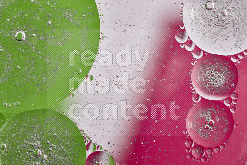 لقطات مقربة لفقاعات من الزيت على سطح الماء باللون الوردي والأخضر والأبيض