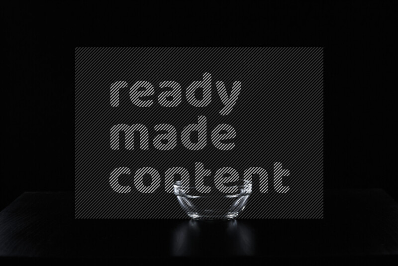 Glassware with rim light against black background