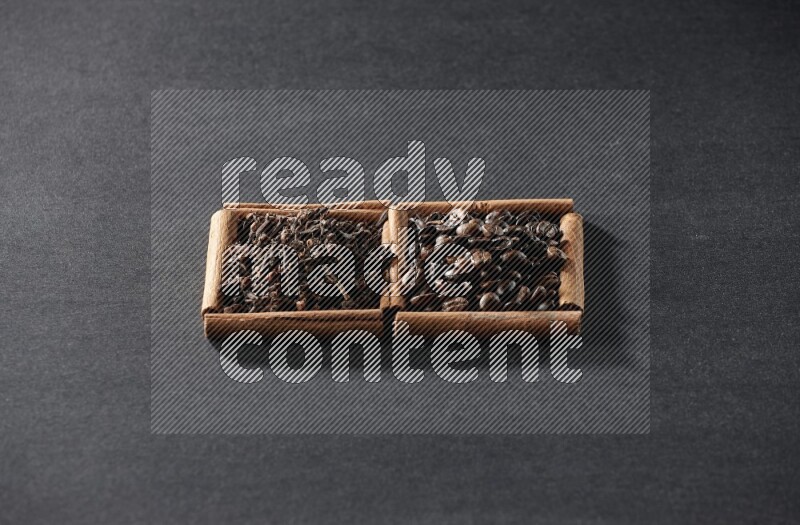2 squares of cinnamon sticks full of coffee beans and cloves on black flooring