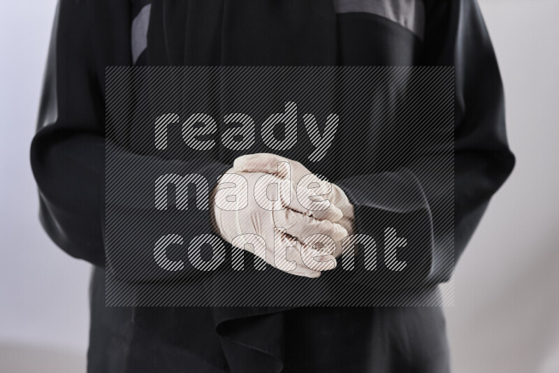 Female doctor wearing an abaya and medical attire in different positions