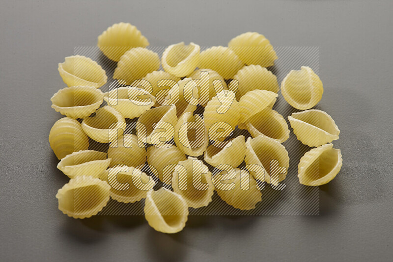 Shells pasta on grey background