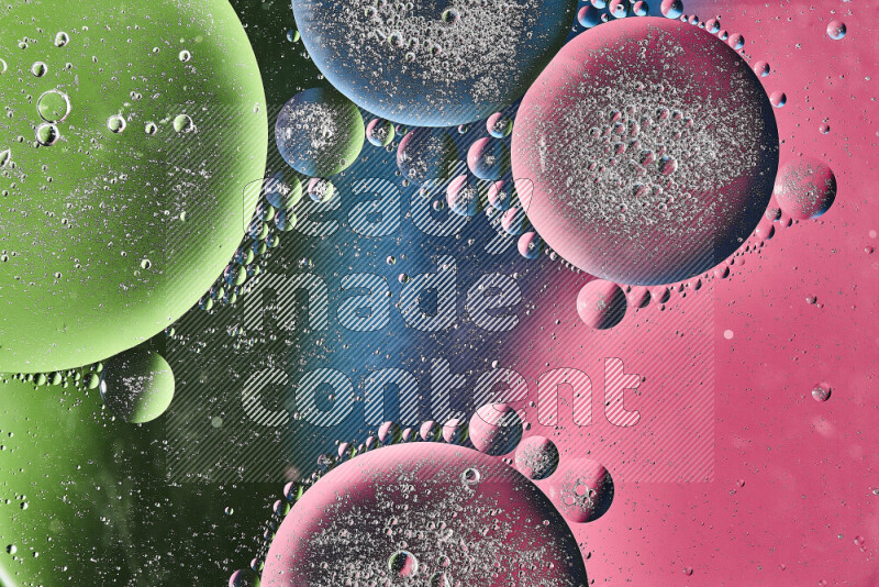 Close-ups of abstract oil bubbles on water surface in shades of pink, green and blue
