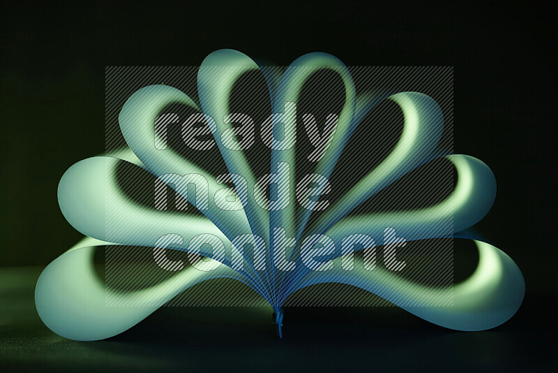 An abstract art piece displaying smooth curves in green gradients created by colored light