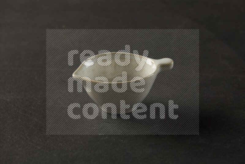 multi color round bowl on grey textured countertop