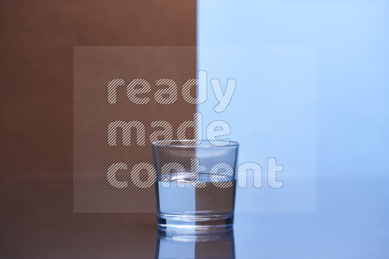 The image features a clear glassware filled with water, set against brown and light blue background