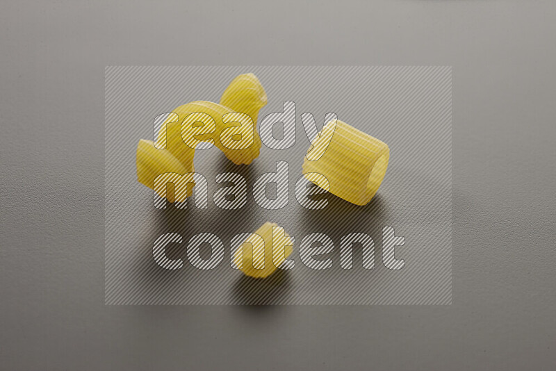 Different pasta types on grey background