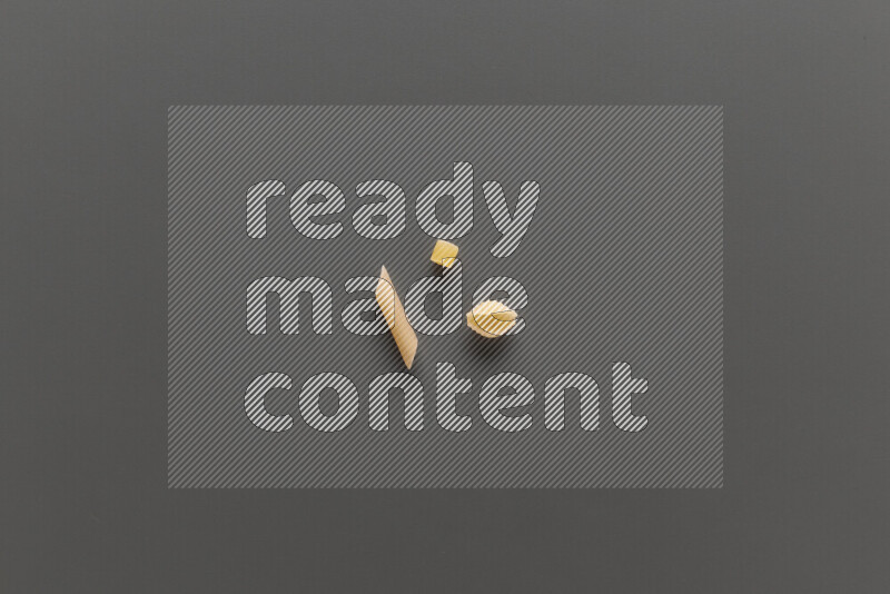Different pasta types on grey background