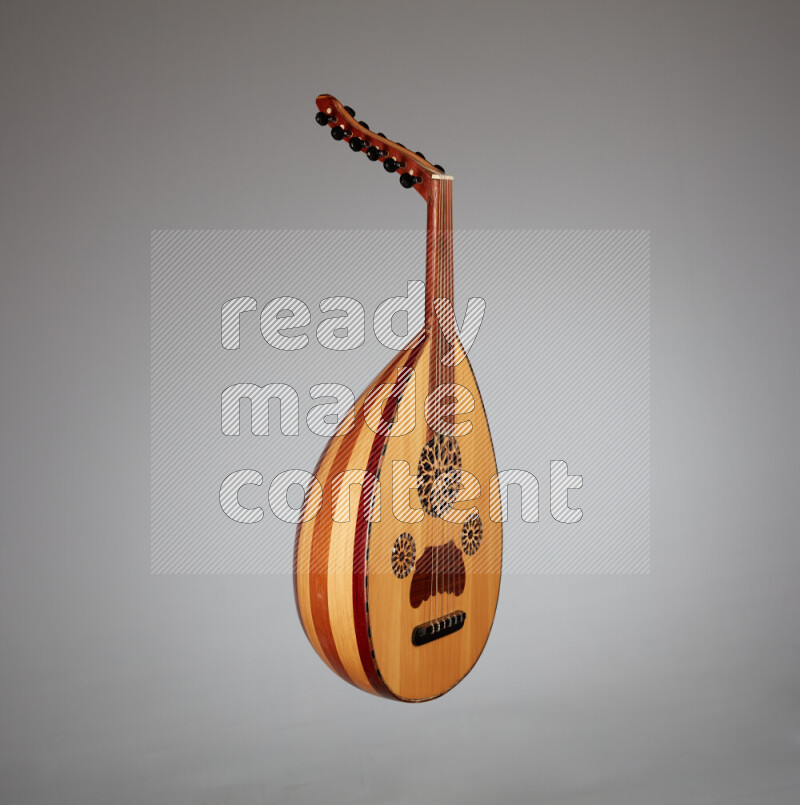a wooden brown Oud on a gray background
