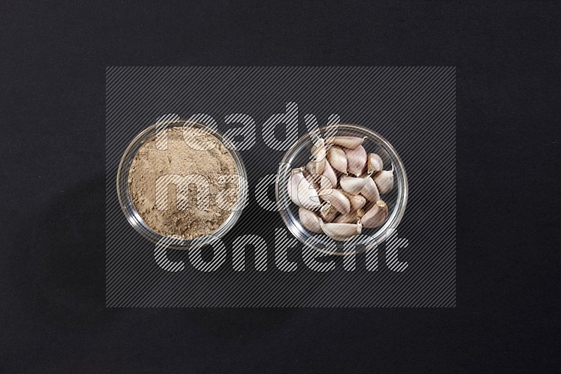 2 glass bowls full of garlic powder and cloves on a black flooring in different angles