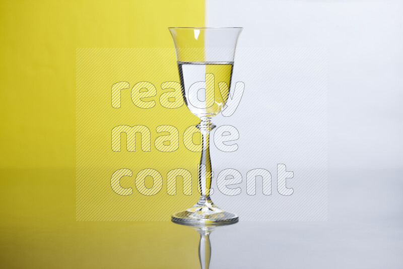 The image features a clear glassware filled with water, set against white and yellow background