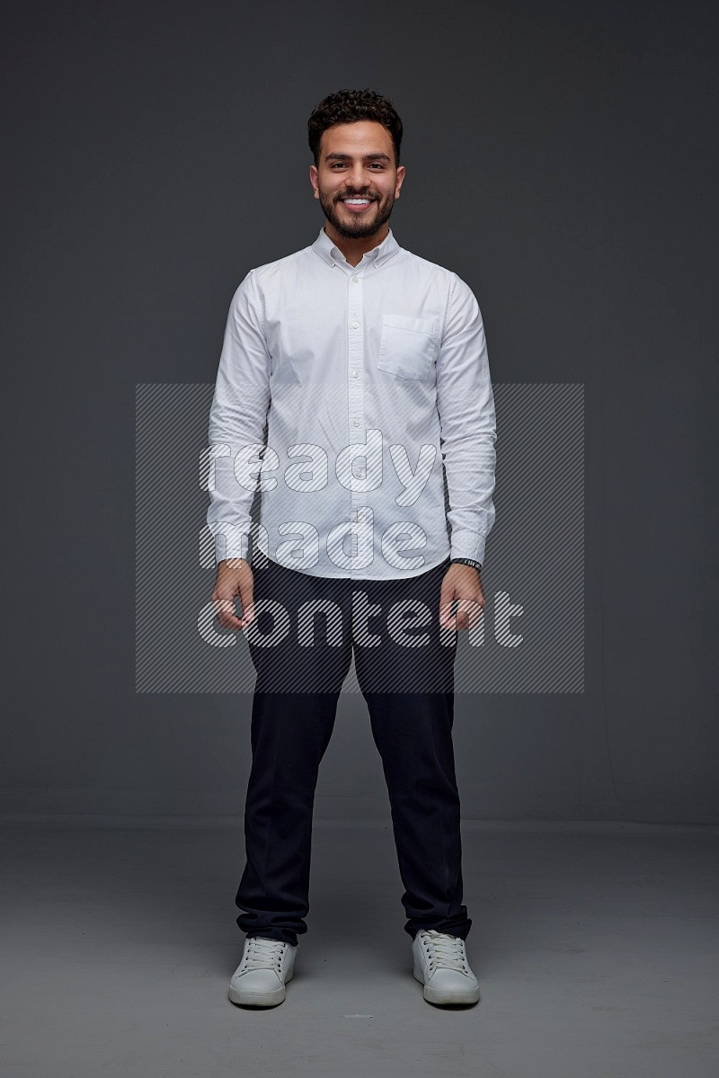 A man wearing smart casual making multi stand poses  eye level on a gray background