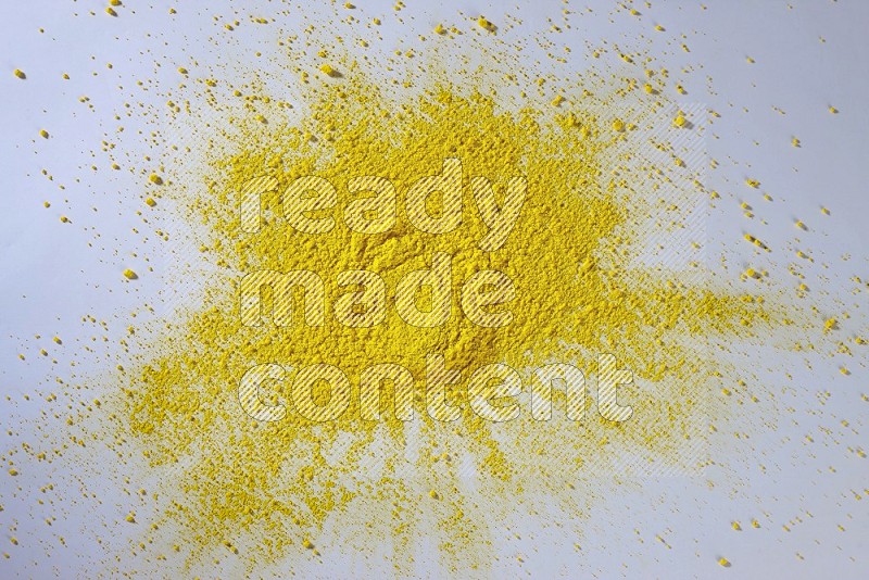 Yellow powder on white background
