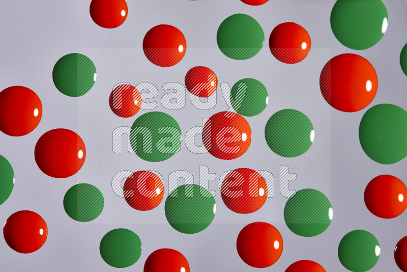 Close-ups of abstract red and green paint droplets on the surface