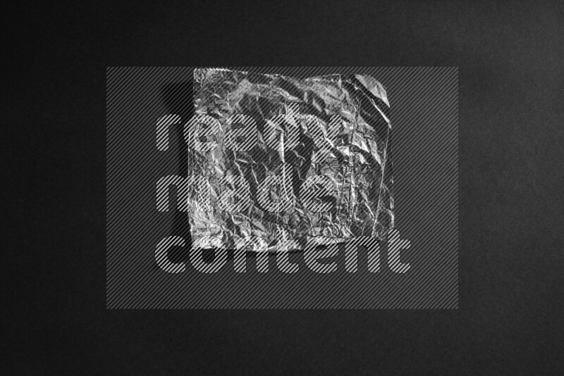 Aluminium foil on black background