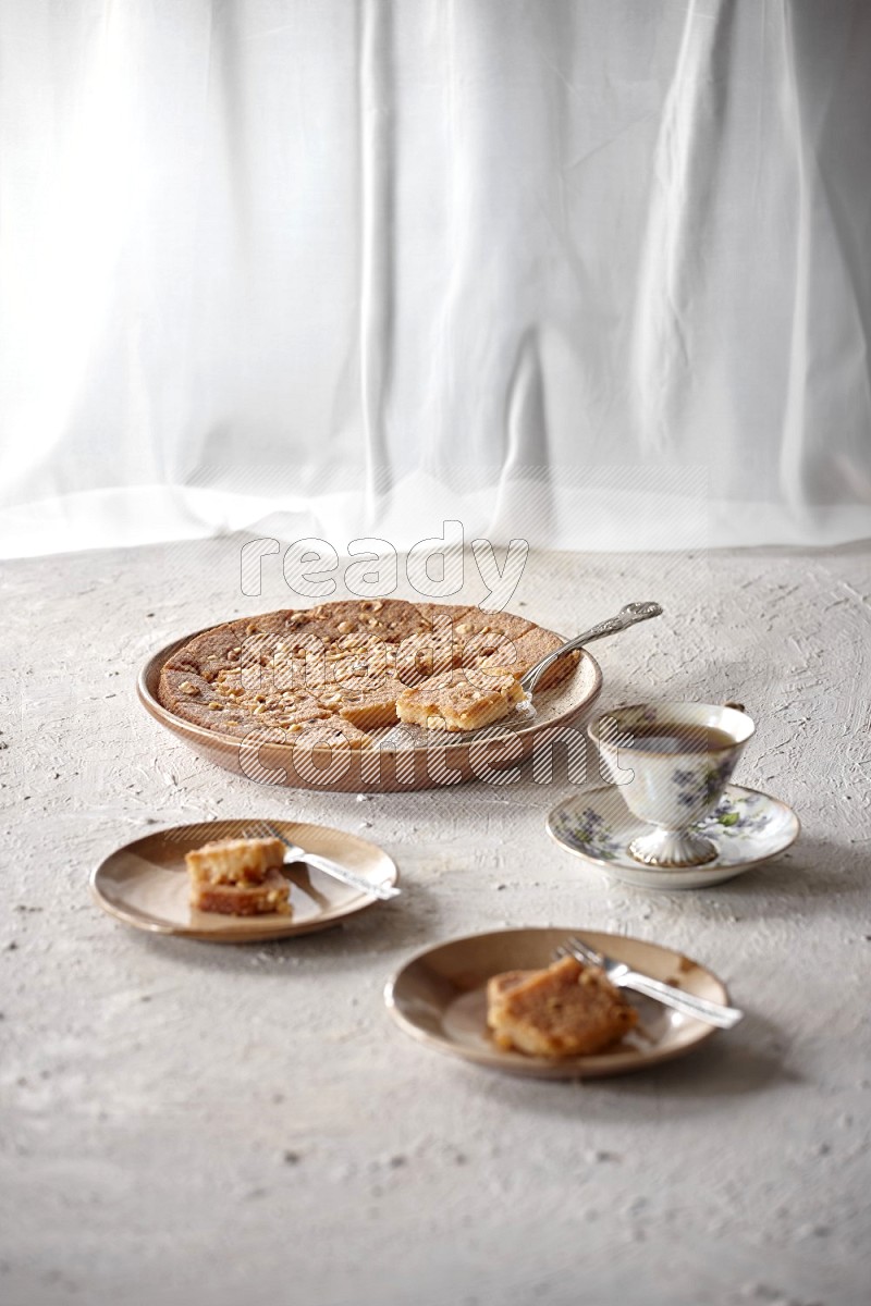 Basbousa with tea in a light setup