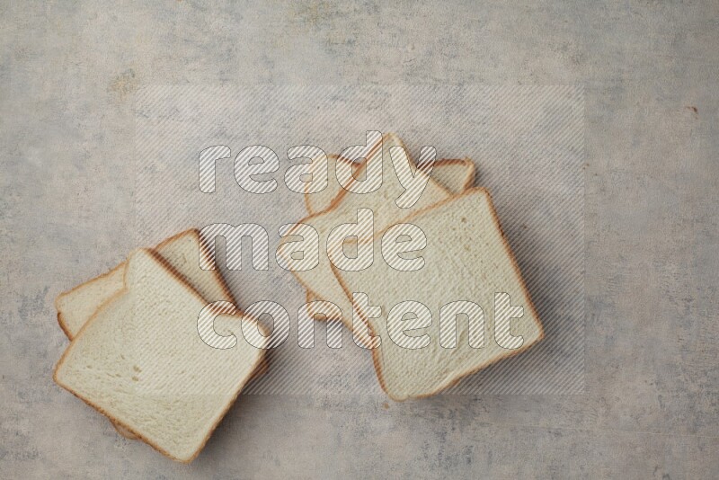 White Toast slices on alight blue textured background