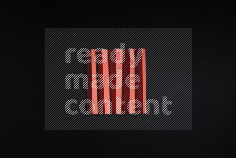 Red paper sheet on black background