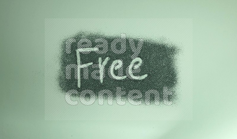 A word written with green glitter on green background