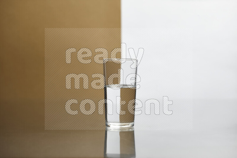 The image features a clear glassware filled with water, set against white and beige background