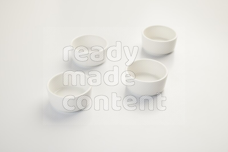 white ceramic round sauce dish on white countertop
