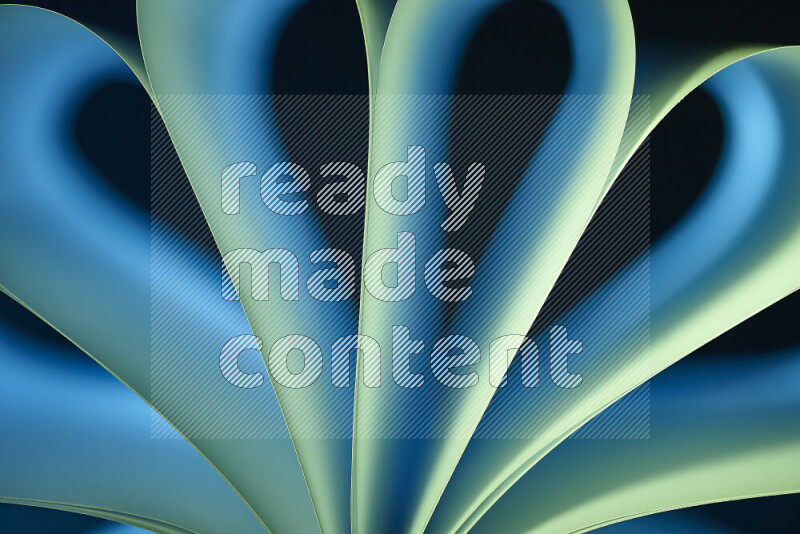 An abstract art piece displaying smooth curves in blue and green gradients created by colored light