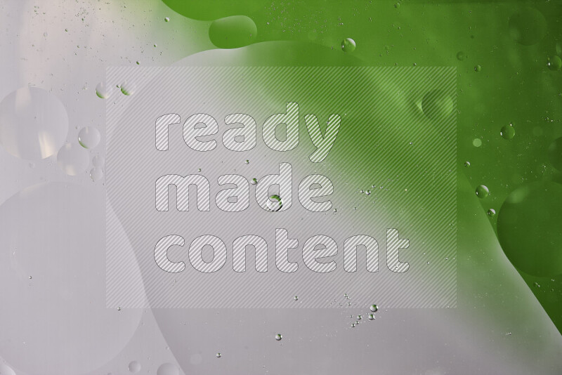 Close-ups of abstract oil bubbles on water surface in shades of white and green