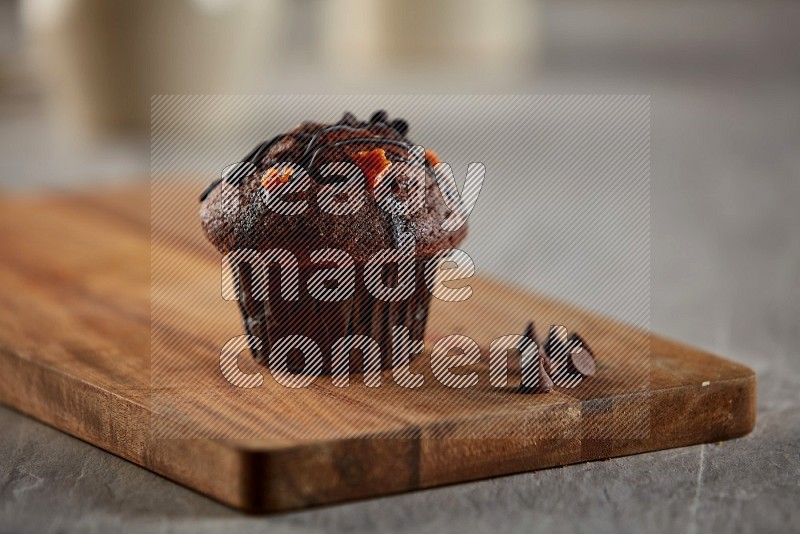 Chocolate cupcake on a wooden board