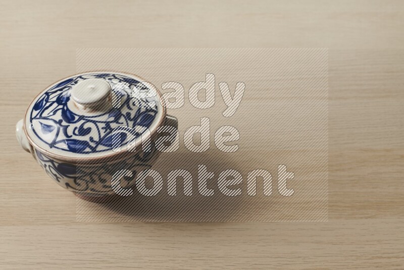 Multicolored Pottery Pot on Oak Wooden Flooring, 45 degrees