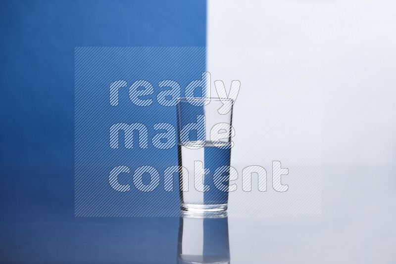 The image features a clear glassware filled with water, set against white and blue background