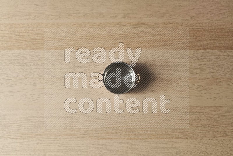 Top View Shot Of A Small Copper Pot on Oak Wooden Flooring