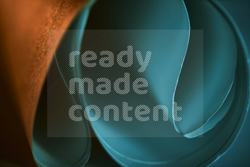 An abstract art piece displaying smooth curves in blue and orange gradients created by colored light