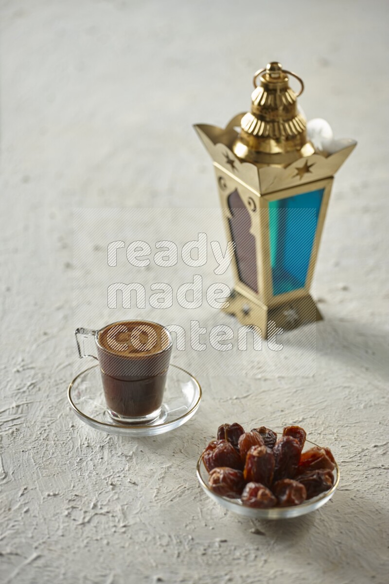A golden lantern with different drinks, dates, nuts, prayer beads and quran on textured white background