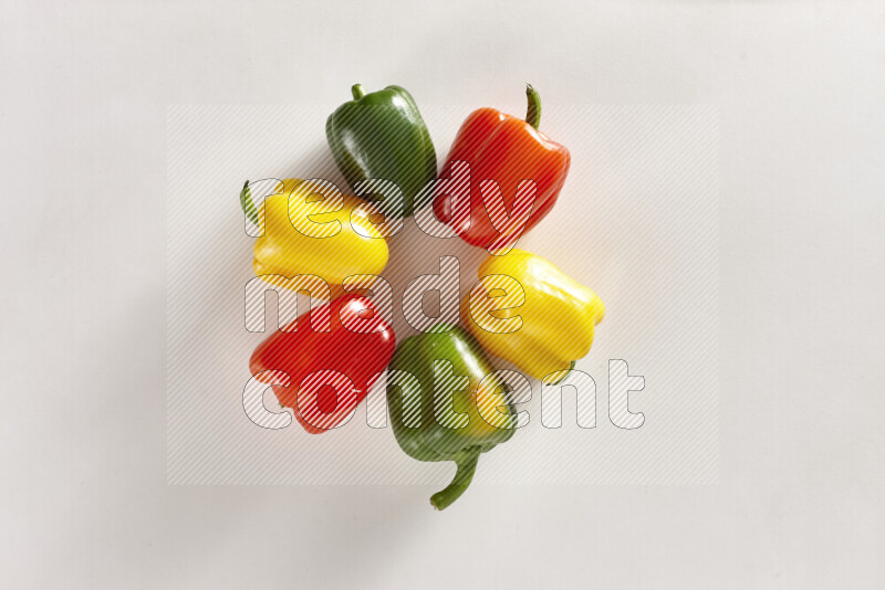 Assorted bell peppers on white background