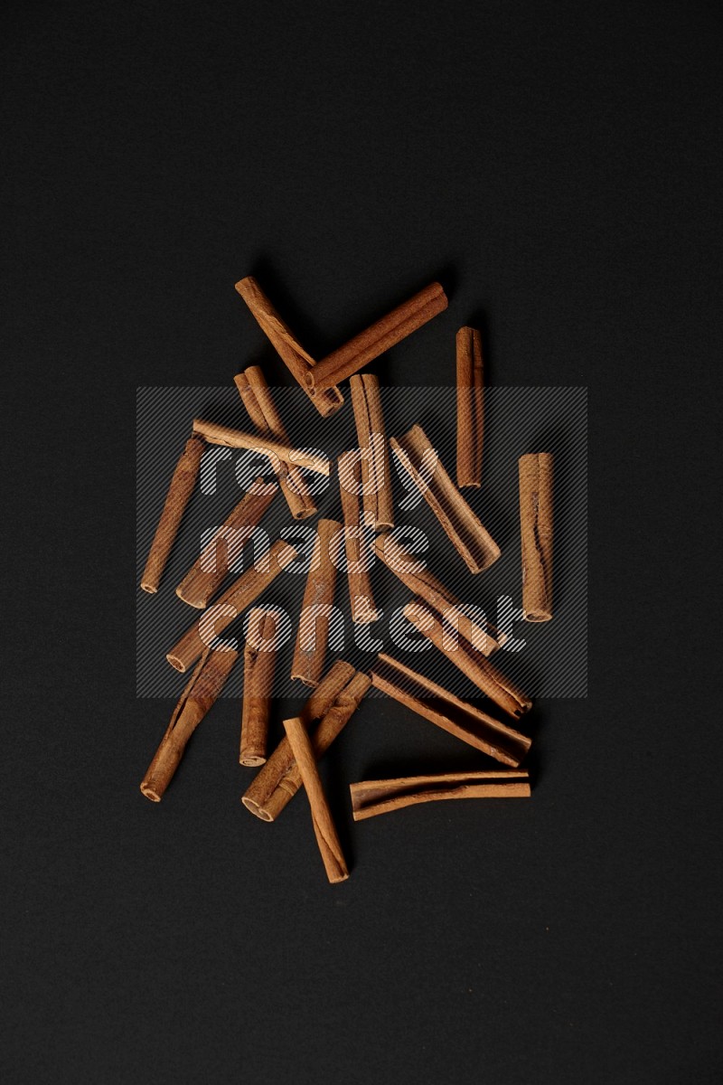Cinnamon sticks on black background