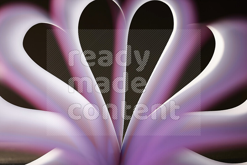 An abstract art piece displaying smooth curves in white and purple gradients created by colored light