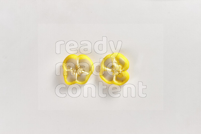 Yellow bell pepper slices on white background