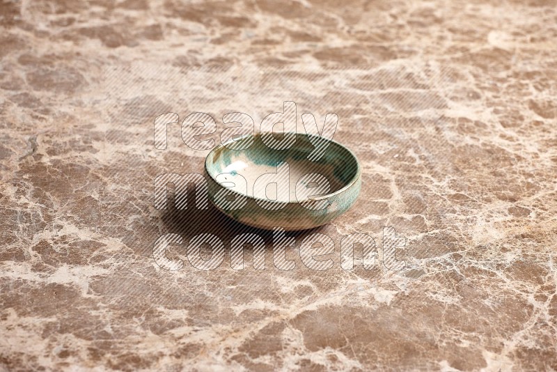 Multicolored Pottery Plate on Beige Marble Flooring, 45 degrees