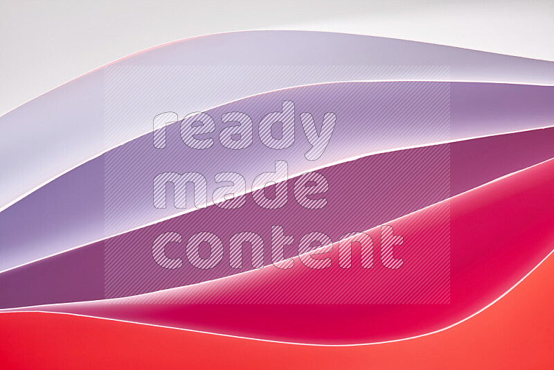 This image showcases an abstract paper art composition with paper curves in white and different warm gradients created by colored light