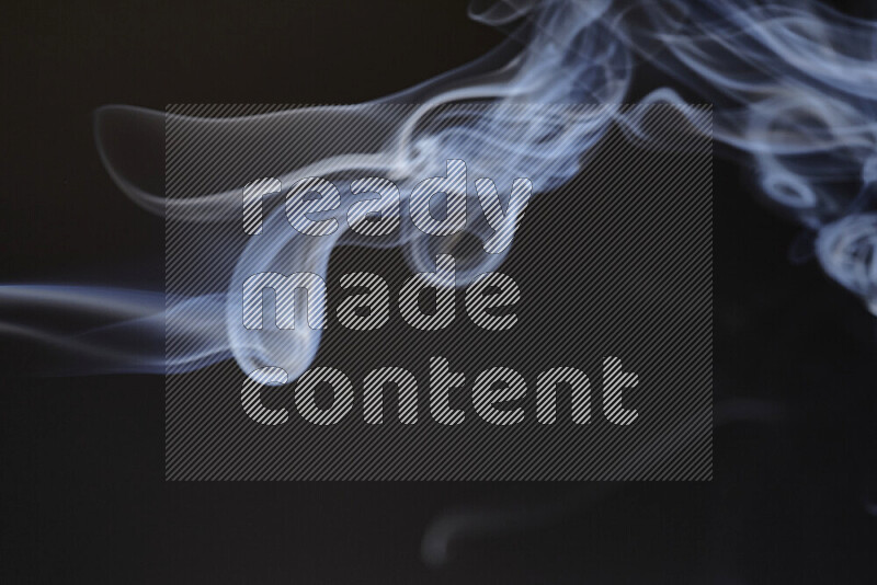 Motion of wavy smoke isolated on dark background