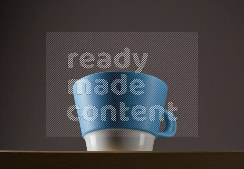 Low angle shot of a bicolor cup on grey background