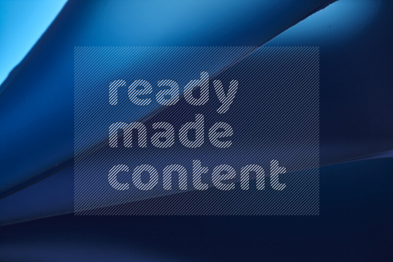 An abstract art piece displaying smooth curves in cold gradients created by colored light