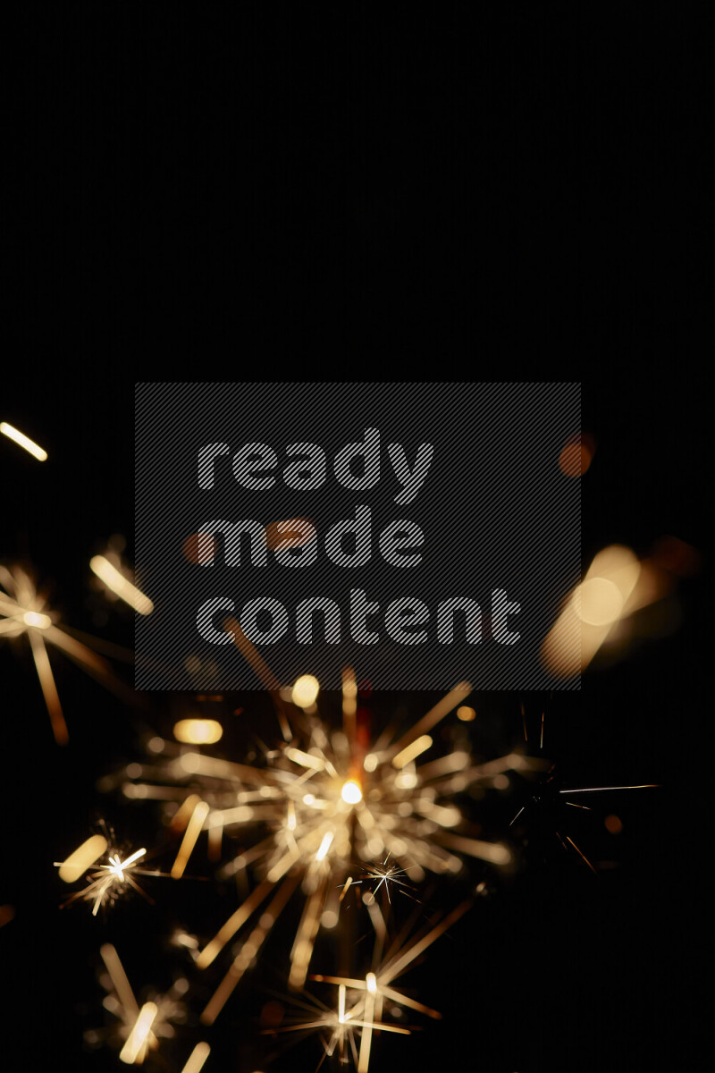 A close-up image of sparkler candle isolated on black background