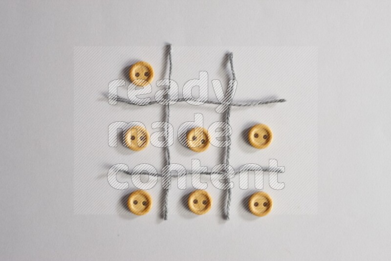 Wooden buttons placed on grey background