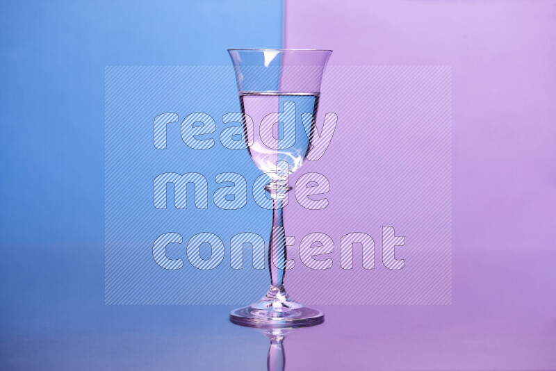 The image features a clear glassware filled with water, set against blue and light purple background