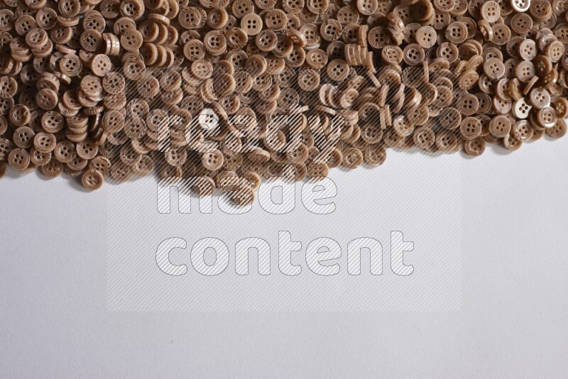 Brown buttons placed on grey background